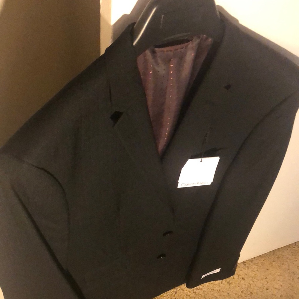 Brand new Men’s Suite. Calvin Klein Sports Coat. Matching pants by Towncraft.